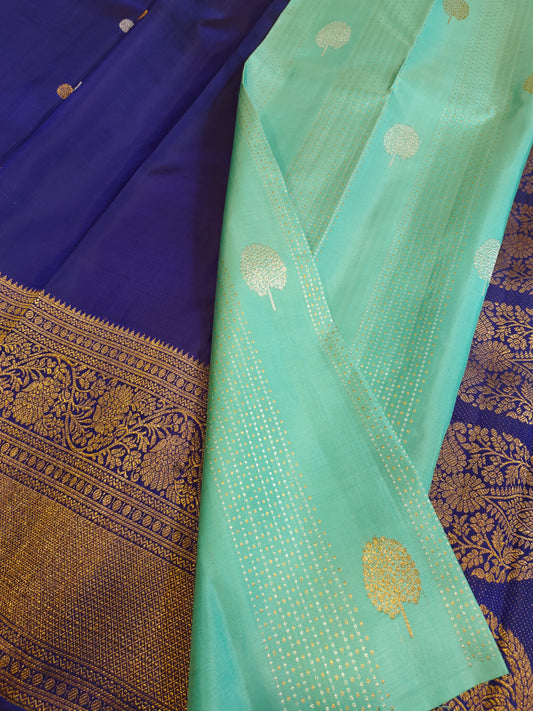 Borderless Light Teal Body with Gold and Silver Zari Vertical Lines and Big Gold and Silver Tree Buttas. Patli Pallu Jamun Purple