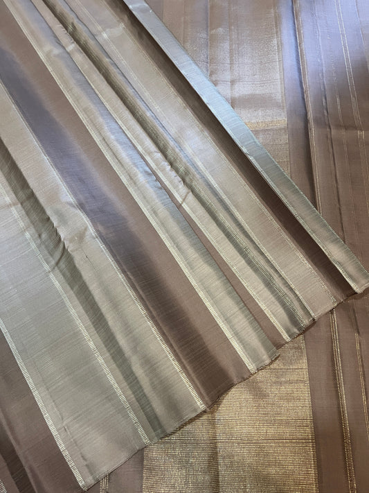 Borderless Shades of Raspberry Glace with Silver and Gold Vertical Lines Placed floral motifs in the front  Kanjivaram Silk Saree
